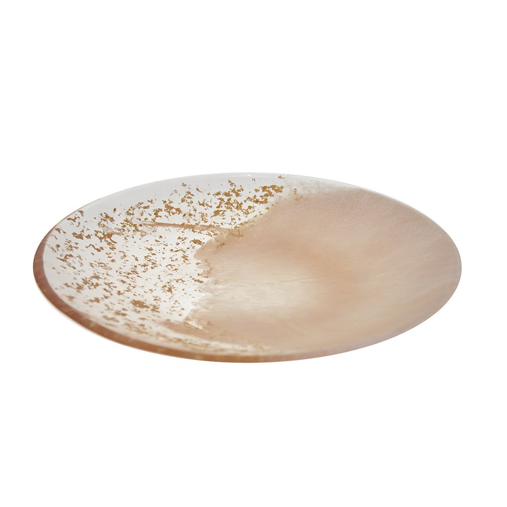 Round ceramic plate with gold speckles on a white background